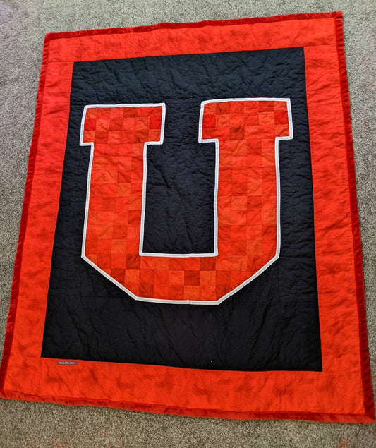 Licensed University of Utah Block U with white edging quilt.